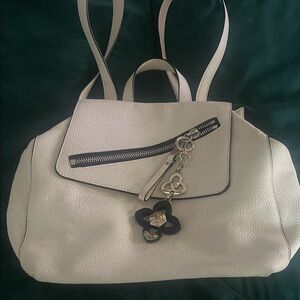 Henri Bendel Cream Shoulder Backpack with Silver hardware.